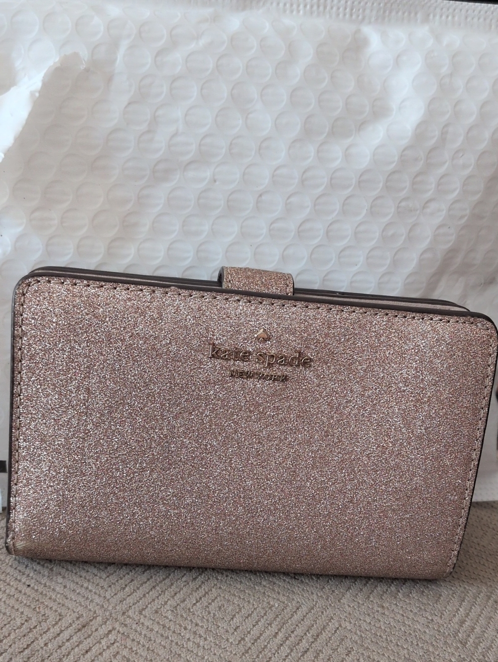 kate spade glitter wallet in rose gold shimmer